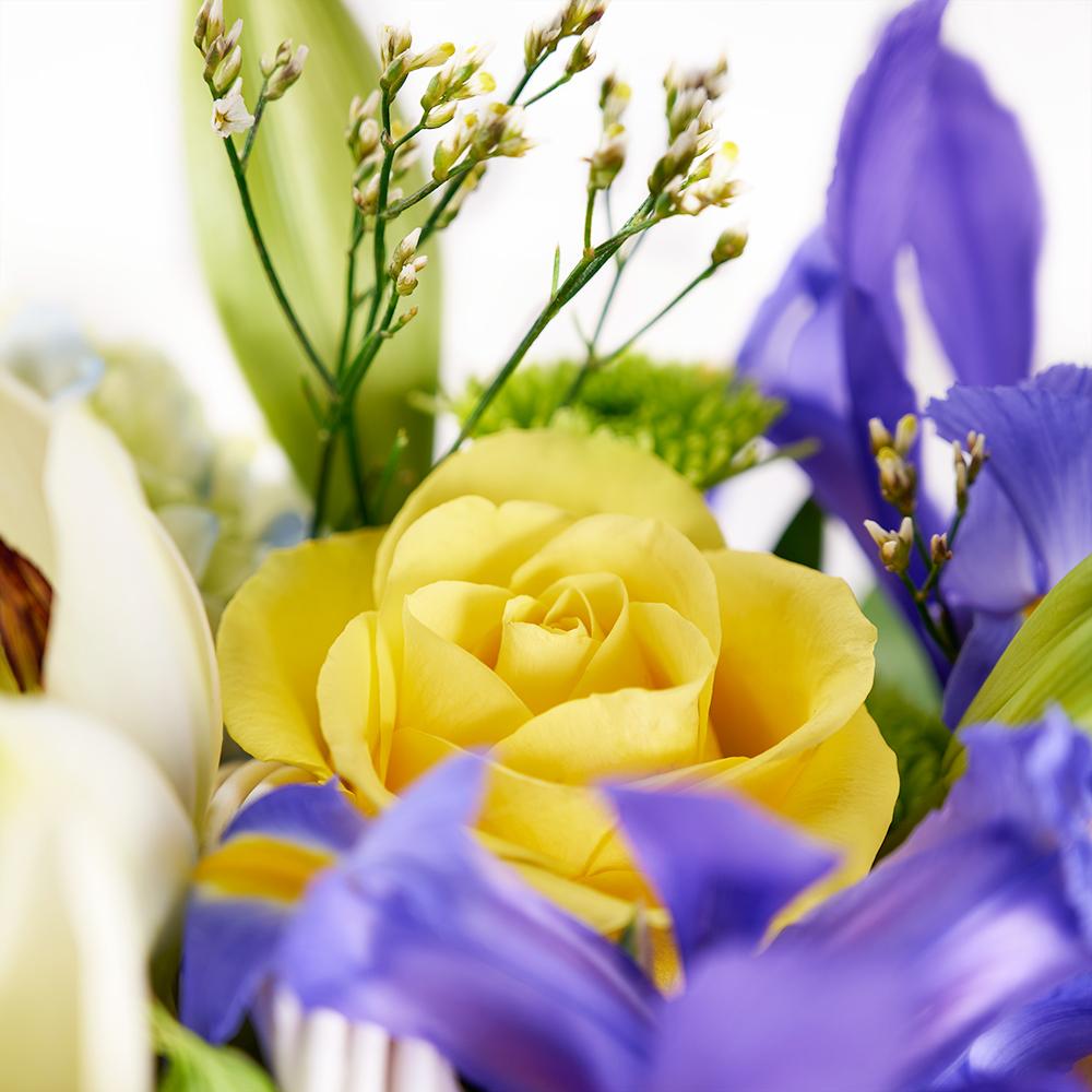 Irises in Paradise Mixed Arrangement. Irises, Roses, Hydrangea, Lilies, Spray Roses, Daisies, and Greens in a Charming Wicker Basket. Mixed Floral Gifts from Heart & Thorn USA - Same Day USA Delivery.