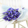 Lavish Lavender Iris Bouquet. Irises, Roses, Hydrangea, Lilies, Spray Roses, Daisies, and Greens in a Charming Wicker Basket. Flower Gifts from Heart & Thorn USA - Same Day USA Delivery.