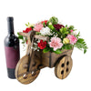 Sweet Talk Floral Gift Set. Multi-Colored Carnations, Baby’s Breath, and Greens in a Charming Wooden Cart Planter, with a Bottle of Red Wine. Floral Gifts from Heart & Thorn USA - Same Day USA Delivery.