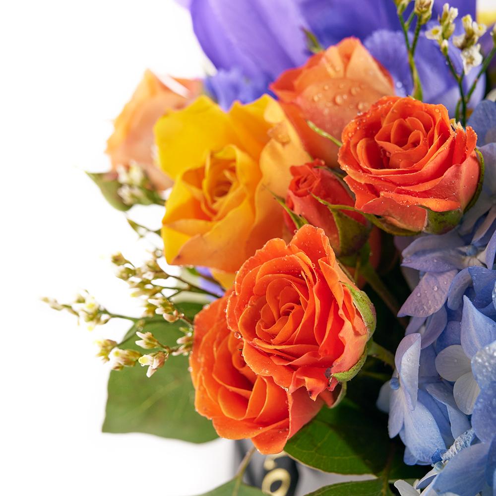 Bursting Beauty Iris Box Arrangement. Roses, Irises, Spray Roses, Hydrangea, Lily, and Greens Gathered Together in a Stylish Box. Mixed Flower Gifts from Heart & Thorn USA - Same Day USA Delivery.