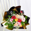 Enduring Charm Rose Bouquet. Selection of Roses in a Variety of Colors Along with Baby’s Breath in a Floral Wrap and Tied with Designer Ribbon. Mixed Floral Gifts from Heart & Thorn USA - Same Day USA Delivery.