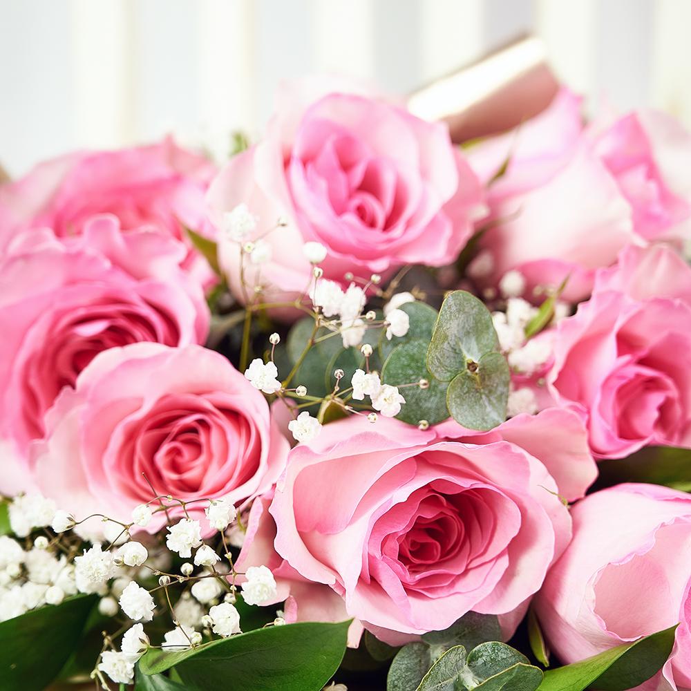 Mother's Day 12 Stem Prink Rose Bouquet. Dozen Pink Roses with Baby’s Breath and Greens in a Floral Wrap and Tied with Designer Ribbon. Flower Gifts from Heart & Thorn USA - Same Day USA Delivery.